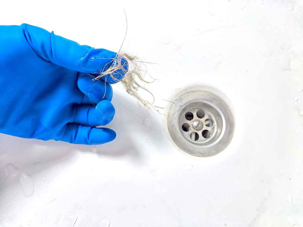 drain clogged with pet fur/dander