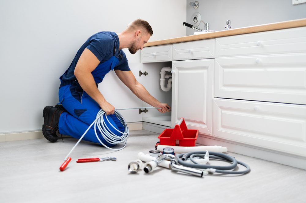 technician cleaning drains technician cleaning drains