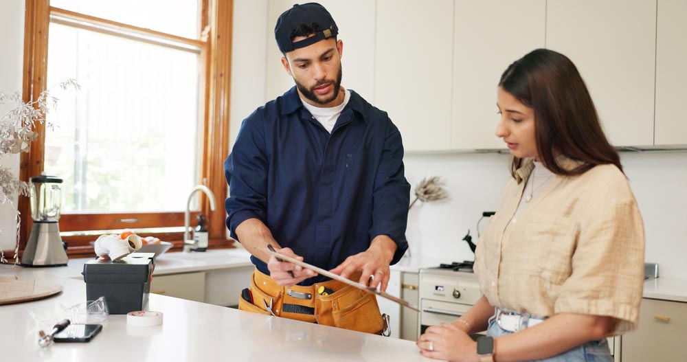 client talking to plumber
