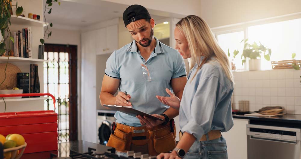 plumber talking to client