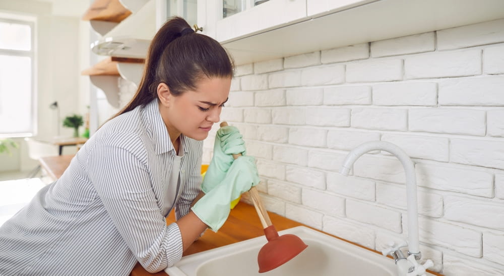 unclogging kitchen sink drain